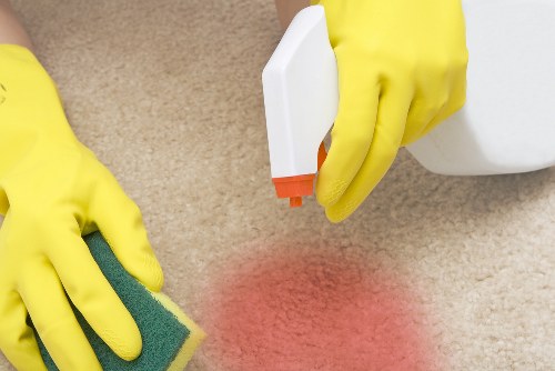 Professional end of tenancy cleaning team working in a Merton flat kitchen